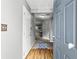 Welcoming entryway featuring hardwood floors, neutral walls, and a glimpse into the living areas at 320 Little Creek Rd, Lawrenceville, GA 30045
