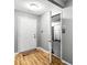 Inviting entryway with hardwood floors, textured ceiling, and access to the garage through an open door at 320 Little Creek Rd, Lawrenceville, GA 30045