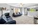 Spacious living room with neutral carpet, fireplace and lots of natural light at 320 Little Creek Rd, Lawrenceville, GA 30045