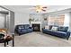 Inviting living room features fireplace, two sofas, neutral paint and lots of natural light at 320 Little Creek Rd, Lawrenceville, GA 30045