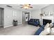 Cozy living room with plush carpet, fireplace, ceiling fan and neutral paint at 320 Little Creek Rd, Lawrenceville, GA 30045