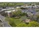 Beautiful aerial view of community buildings, lush green landscape, and parking area at 5920 Bond St # B206, Cumming, GA 30040