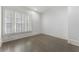 Bedroom with wood floors, plantation shutters and neutral paint throughout the home at 5920 Bond St # B206, Cumming, GA 30040
