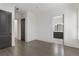 Open bedroom shows dark wood floors, walk in closet, and a bathroom with modern vanity at 5920 Bond St # B206, Cumming, GA 30040