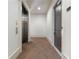 Hallway features an elevator and door to a private residence at 5920 Bond St # B206, Cumming, GA 30040