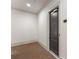 Hallway with a dark wooden door marked 206 and a 'Private Residence' sign, carpeted floors, and white walls at 5920 Bond St # B206, Cumming, GA 30040