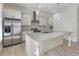 Bright kitchen featuring stainless steel appliances and an island at 5920 Bond St # B206, Cumming, GA 30040