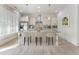 Modern kitchen featuring white cabinets, a marble island with seating, and stainless steel appliances at 5920 Bond St # B206, Cumming, GA 30040
