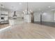 Open concept kitchen featuring a kitchen island and stainless steel appliances at 5920 Bond St # B206, Cumming, GA 30040
