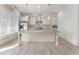 Modern kitchen with white cabinets, stainless steel appliances, and granite countertops at 5920 Bond St # B206, Cumming, GA 30040
