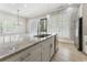 Kitchen island with stainless steel appliances at 5920 Bond St # B206, Cumming, GA 30040