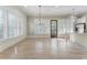 Bright living room featuring large windows with plantation shutters and light tile flooring at 5920 Bond St # B206, Cumming, GA 30040