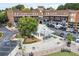 Town center with charming architecture, landscaped walkways, shops, and ample parking at 5920 Bond St # B206, Cumming, GA 30040