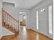 Inviting foyer with hardwood floors and staircase at 701 Belgrave Ln, Tucker, GA 30084