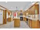 Spacious eat-in kitchen with an island and light wood cabinetry and neutral countertops at 701 Belgrave Ln, Tucker, GA 30084