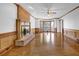 Bright living room boasts hardwood floors, brick fireplace and lots of natural light at 701 Belgrave Ln, Tucker, GA 30084