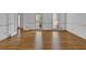 Spacious living room featuring gleaming hardwood floors and natural light at 701 Belgrave Ln, Tucker, GA 30084