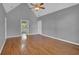 Spacious primary bedroom with hardwood floors and en suite bathroom access at 701 Belgrave Ln, Tucker, GA 30084