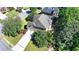 Aerial view of a home with a long driveway and lush landscaping at 1806 Royal Troon Ct, Duluth, GA 30097