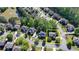 Aerial view of a lovely home in a well-planned neighborhood complete with a pond and mature trees at 1806 Royal Troon Ct, Duluth, GA 30097