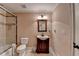 Cozy bathroom featuring a single vanity, and a shower behind glass doors at 1806 Royal Troon Ct, Duluth, GA 30097