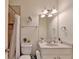 Bathroom featuring a shower, updated vanity, sink, mirror, and toilet at 1806 Royal Troon Ct, Duluth, GA 30097