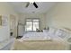 Bedroom with carpet flooring, a ceiling fan, neutral walls, and natural light from the exterior window at 1806 Royal Troon Ct, Duluth, GA 30097