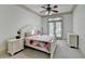 Bright bedroom with neutral carpet, ceiling fan, and access to an outdoor balcony at 1806 Royal Troon Ct, Duluth, GA 30097