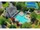 Aerial shot of a community pool, playground, tennis courts and manicured landscaping in a desirable location at 1806 Royal Troon Ct, Duluth, GA 30097
