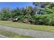 Well-manicured front yard with lush green lawn and mature trees at 1806 Royal Troon Ct, Duluth, GA 30097
