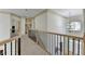 Spacious upstairs hallway with neutral paint, high ceilings, access to multiple rooms, and a wrought iron bannister at 1806 Royal Troon Ct, Duluth, GA 30097