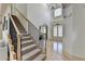 Grand staircase leads to the upper level in this impressive foyer at 1806 Royal Troon Ct, Duluth, GA 30097