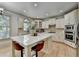 Modern kitchen featuring granite counters, stainless appliances, and custom cabinetry at 1806 Royal Troon Ct, Duluth, GA 30097