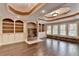 Large living room featuring a fireplace, built-in shelving, and many windows offering ample natural light and scenic views at 1806 Royal Troon Ct, Duluth, GA 30097