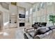 Spacious living room boasting a fireplace, built-ins, and large windows at 1806 Royal Troon Ct, Duluth, GA 30097