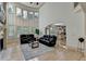Bright, open living room with soaring windows and hardwood floors at 1806 Royal Troon Ct, Duluth, GA 30097