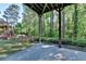 A ground-level patio surrounded by trees at 1806 Royal Troon Ct, Duluth, GA 30097