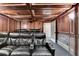 Home theater room with tiered seating, leather recliners, a large screen, and custom wood trim at 1806 Royal Troon Ct, Duluth, GA 30097