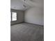 This bedroom features a ceiling fan and a window allowing for plenty of natural light at 586 Rodeo Dr, Auburn, GA 30102