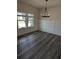 Cozy dining area features wainscoting, modern lighting, and a view of the neighborhood at 586 Rodeo Dr, Auburn, GA 30102