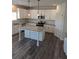 Well-appointed kitchen featuring granite countertops, stainless steel appliances, and a center island at 586 Rodeo Dr, Auburn, GA 30102