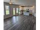 Open floor plan showcases the kitchen with granite counters, stainless appliances, and eat-in area at 586 Rodeo Dr, Auburn, GA 30102