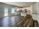Modern kitchen featuring white cabinets, granite countertops, island and an open view at 586 Rodeo Dr, Auburn, GA 30102