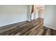 Living room featuring wood flooring and view of stairs at 586 Rodeo Dr, Auburn, GA 30102