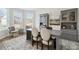 Inviting home office with built-in shelving, gray furnishings, and lots of natural light at 586 Rodeo Dr, Auburn, GA 30102