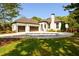 Charming home with a circular driveway, three car garage, and manicured lawn at 1762 Patrick Rd, Dacula, GA 30019