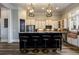 Modern kitchen with stainless steel appliances, granite counters, and stylish barstool seating at 1762 Patrick Rd, Dacula, GA 30019