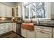 Close up of copper sink, light colored cabinets and granite counters at 1762 Patrick Rd, Dacula, GA 30019