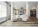 Bright living room with columns, a fireplace and light color interior finishes at 1762 Patrick Rd, Dacula, GA 30019