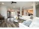Bright living room with hardwood floors, modern decor, and abundant natural light at 1762 Patrick Rd, Dacula, GA 30019